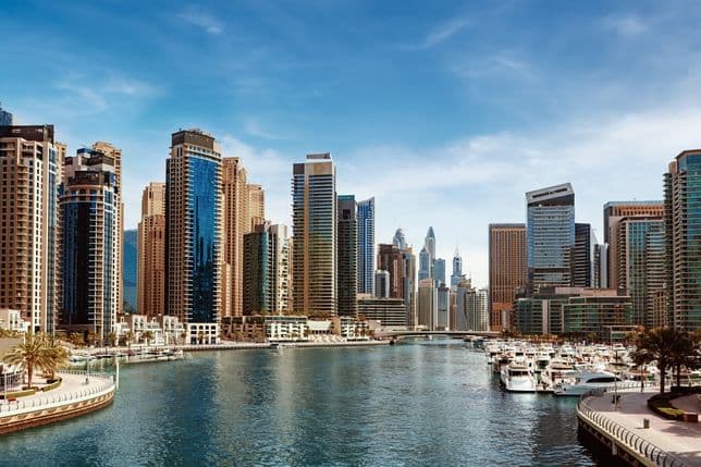 Modern, glass-fronted apartment buildings overlooking the Dubai Marina