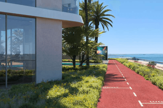 Outdoor jogging track at ELLE Residences surrounded by landscaped podium areas.