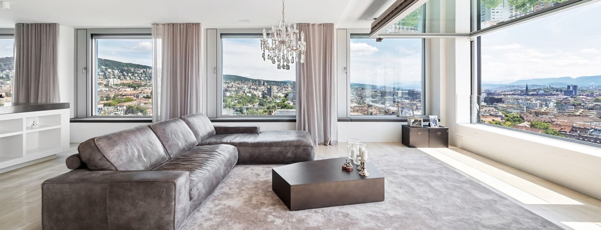 Modern penthouse with large living room and panoramic view of the city of Zurich