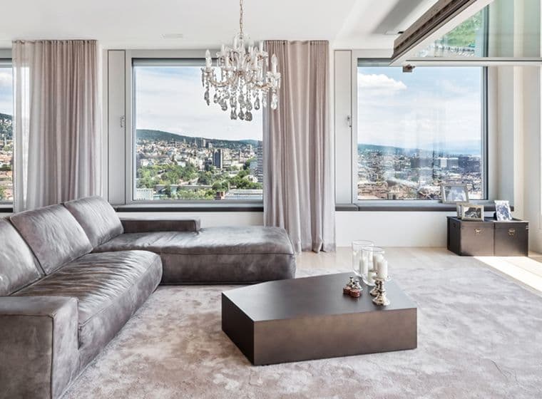 Modern penthouse with large living room and panoramic view of the city of Zurich
