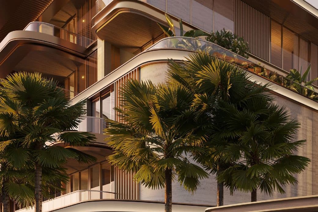 Modern building with curved balconies and glass railings, surrounded by tall palm trees and lush greenery under soft evening light.