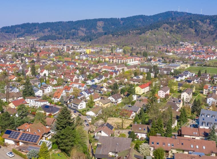 Panoramic aerial image of Freiburg’s residential districts used to illustrate standard land values in different locations