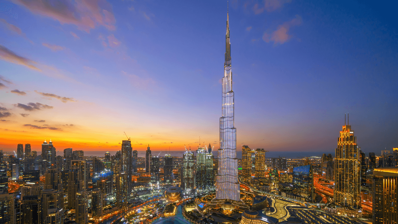 Burj Khalifa and Downtown Dubai skyline at night, showcasing properties by renowned developer Emaar
