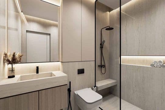 Luxuriöses, spa-inspiriertes Badezimmer im Danube ASPIRZ, Dubai Sports City – mit eleganten Oberflächen, begehbarer Dusche und sanfter Ambientebeleuchtung.