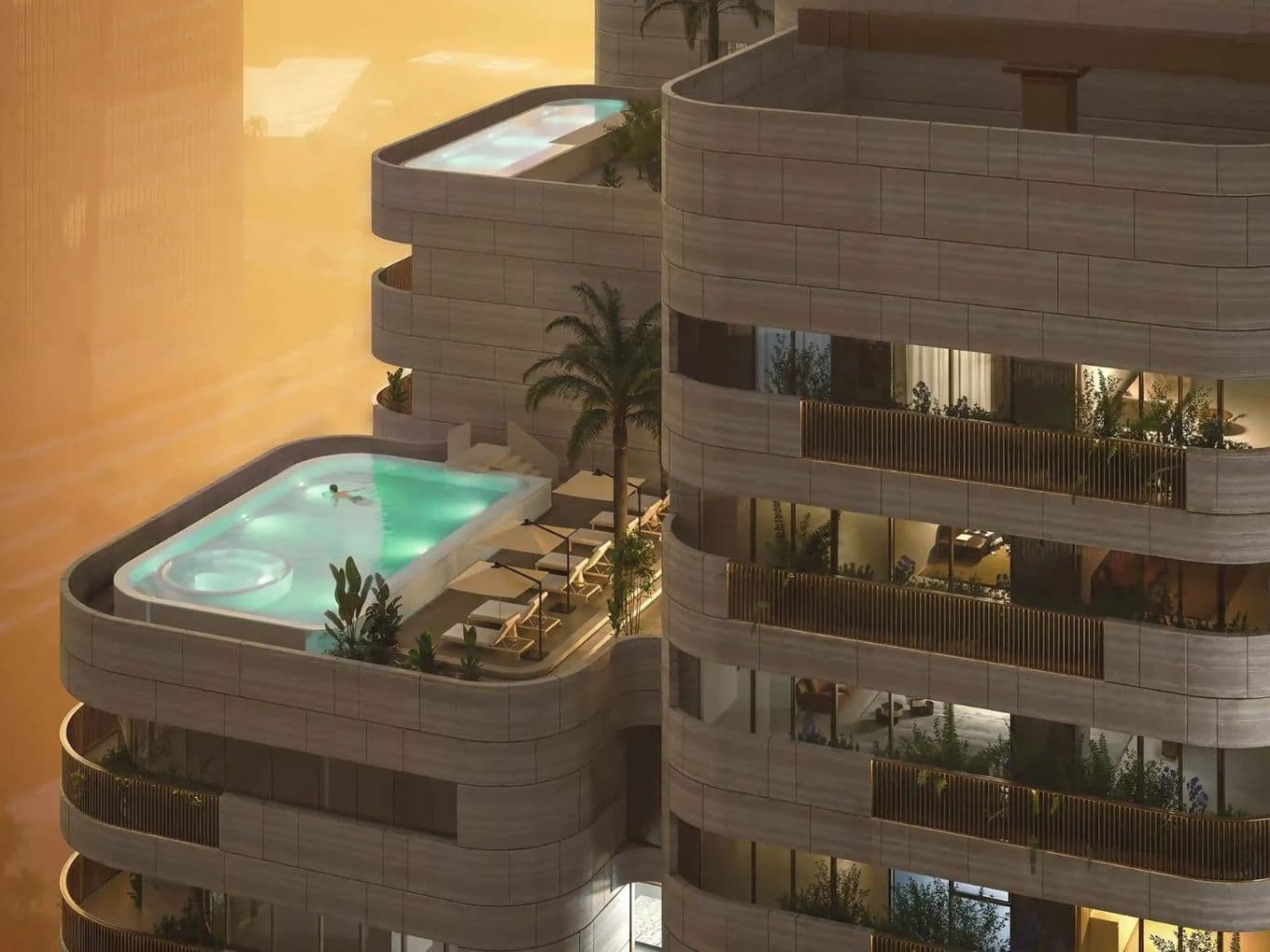 A modern high-rise building with balconies, featuring luxurious penthouses, private pools, palm trees, and lounge chairs against a sunset backdrop.