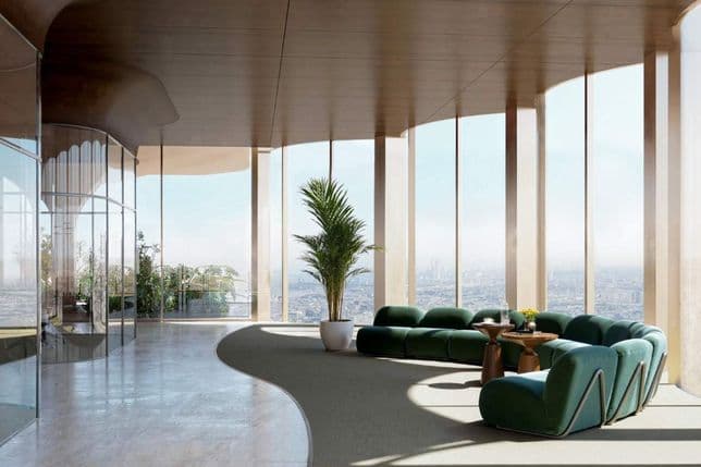 Moderne Bürolounge in Lumena mit grünen Sofas und bodentiefen, gebogenen Glaswänden.