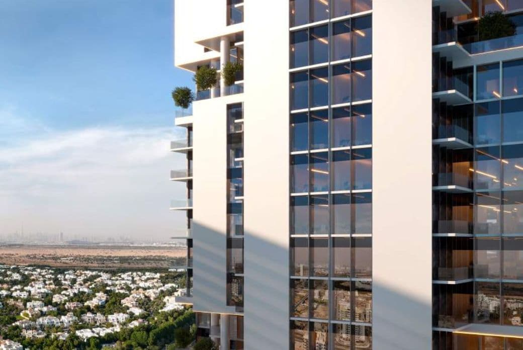 Modern high-rise tower of Samana Barari Avenue with panoramic glass facade overlooking lush villa communities and Dubai skyline in the distance.
