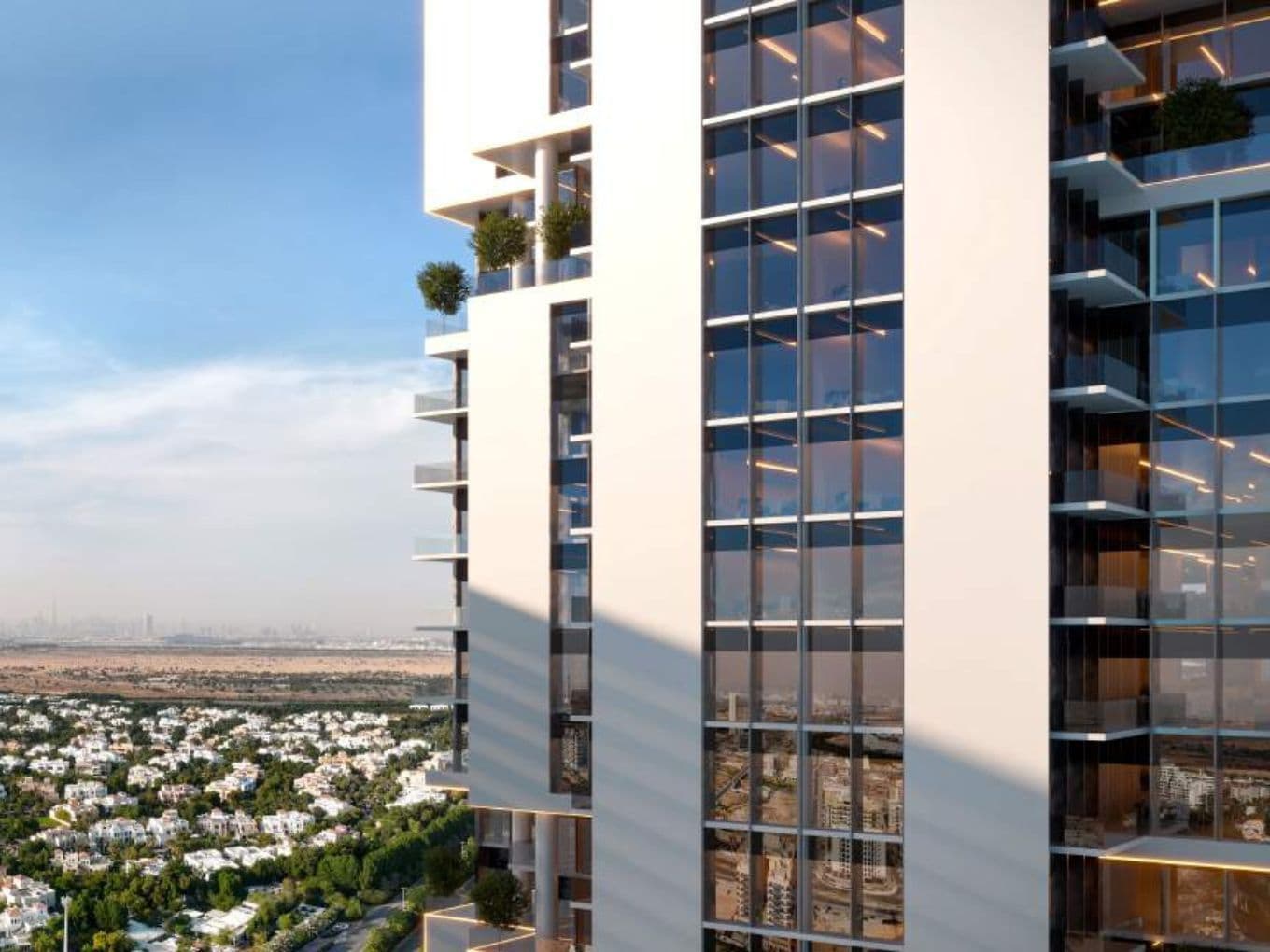 Modern high-rise tower of Samana Barari Avenue with panoramic glass facade overlooking lush villa communities and Dubai skyline in the distance.