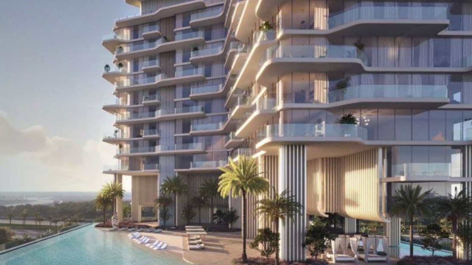 Swimmingpool und Sonnendeck von Octa Isle mit Blick auf die Dubai Islands und das Meer