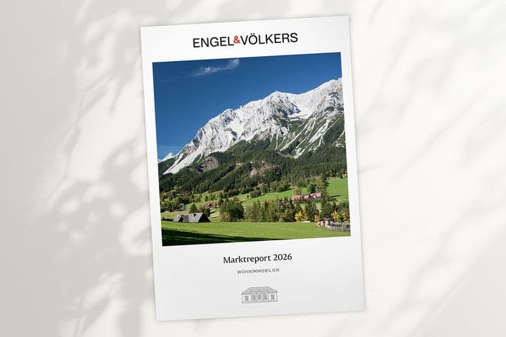 Engel & Völkers report cover showing alpine landscape: green valley, chalets, forest and snow‑capped mountains, titled "Marktreport 2026".