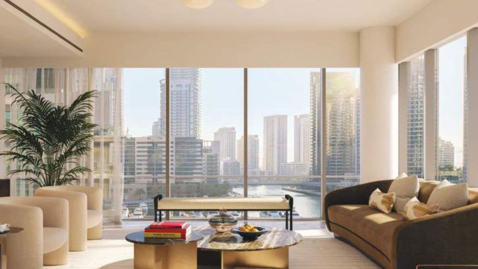 Bright and stylish living room with panoramic Dubai Marina views at Residences Du Port.