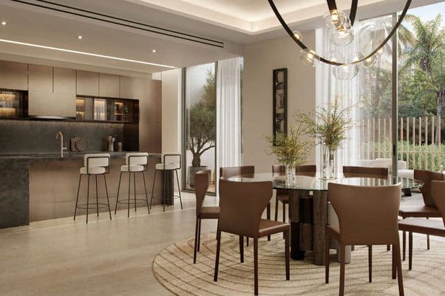 Contemporary kitchen and dining area with garden views at City Walk Crestlane by Meraas, City Walk, Dubai.