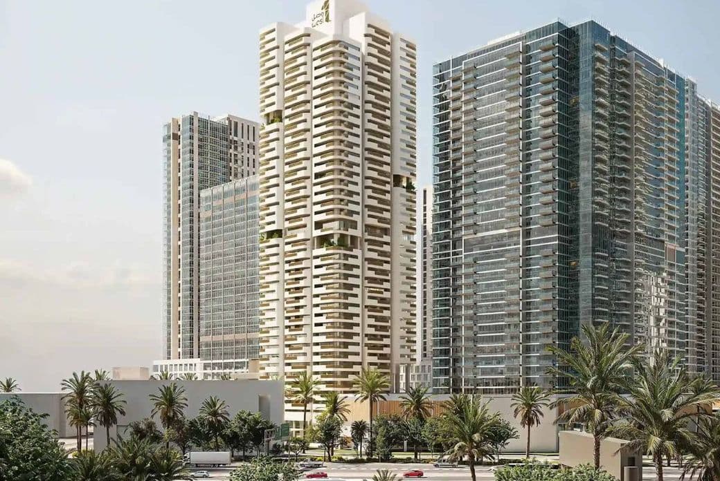 A modern cityscape with tall, glass-clad skyscrapers, surrounded by palm trees and a busy road in the foreground.