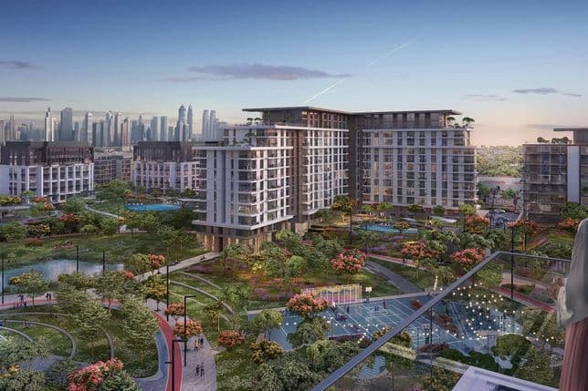 Modern urban development with high-rise buildings, lush green spaces, and water features, set against a city skyline at dusk.