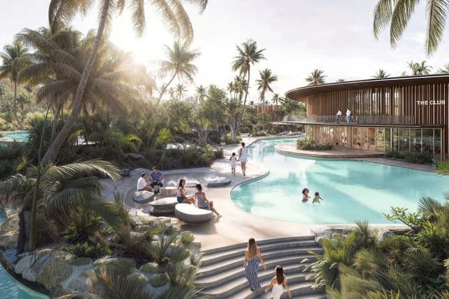 Ein tropisches Resort mit einem geschwungenen Pool, umgeben von Palmen und entspannenden Gästen. Im Hintergrund ist ein modernes Gebäude zu sehen.