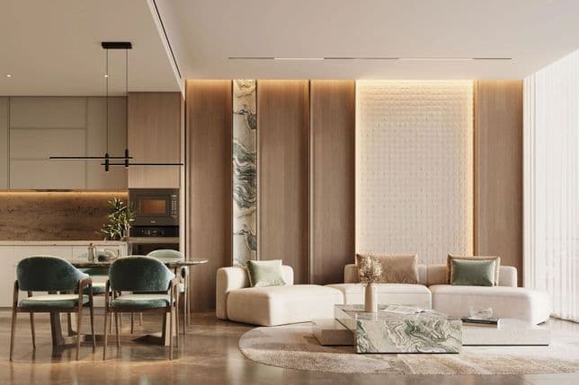 Modern living and dining area with marble accents, plush sofas, green chairs, and soft lighting, creating an elegant and cozy atmosphere.