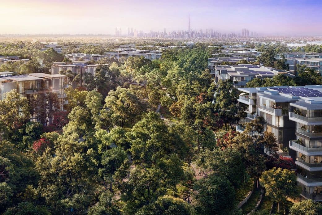 Distrikt Apartment Buildings sat amongst lush greenery with the Downtown Dubai skyline and Burj Khalifa in the background