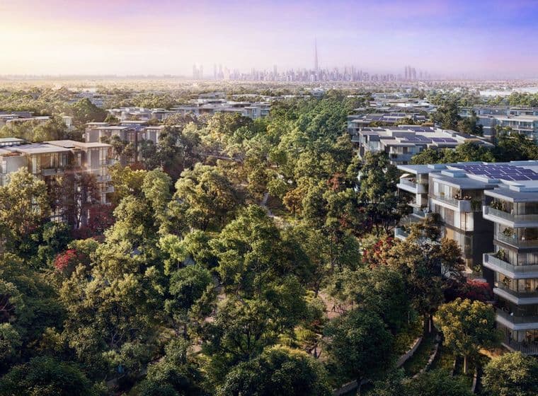 Distrikt Apartment Buildings sat amongst lush greenery with the Downtown Dubai skyline and Burj Khalifa in the background