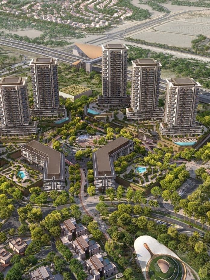 Aerial view of Rise by Aldar with multiple high-rise buildings, surrounded by greenery, roads, and nearby structures.