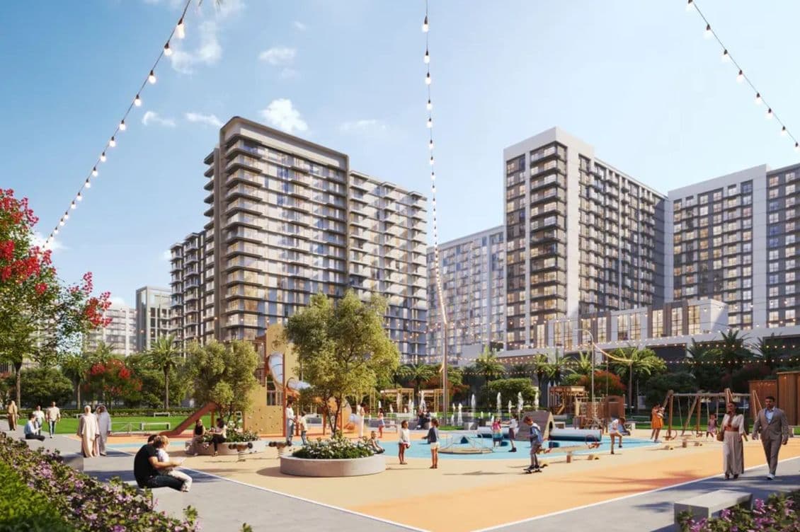 A vibrant urban park with people enjoying a playground. High-rise buildings in the background and string lights above enhance the lively scene.