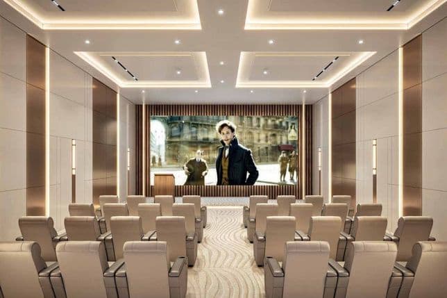 Indoor cinema room with plush seating and large screen at Danube ASPIRZ, Dubai Sports City by Danube Properties