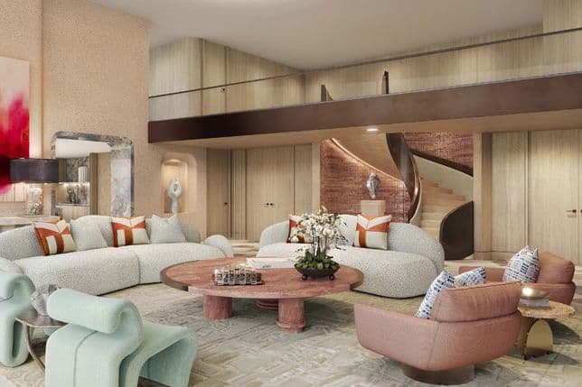 Elegant living room with art pieces, curved furniture, and a feature staircase in a luxury residence.