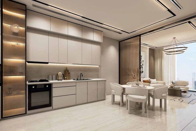Contemporary kitchen and dining area at Danube ASPIRZ, Dubai Sports City, featuring sleek cabinetry and open-plan design with city views.