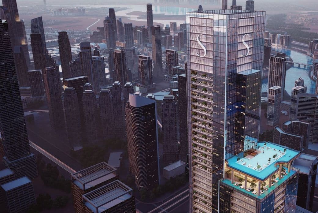 Sobha Skyparks with rooftop pool, surrounded by a cityscape of modern high-rise buildings, under a cloudy sky.