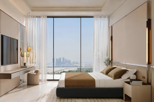 Modern bedroom with a large window view of the city skyline and water, beige bedding, neutral palette, built-in storage, and sheer curtains. AI-generated image