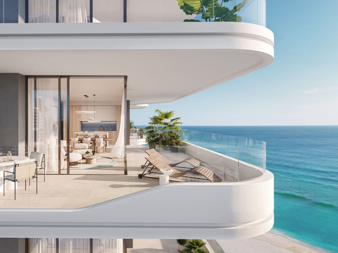 Expansive balcony with sea view at Nikki Beach Residences by Aldar in RAK, showcasing elegant outdoor lounge and dining space.