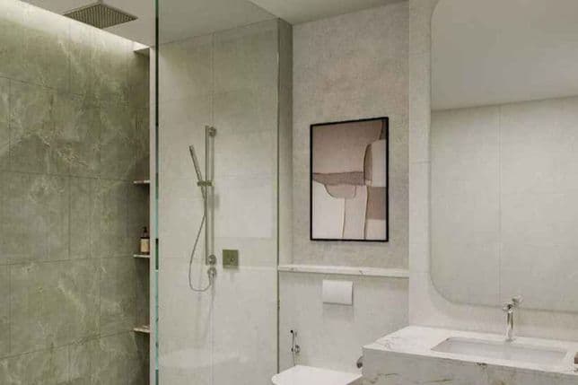 Modern bathroom with glass shower, rainfall and handheld showerheads, wall-mounted toilet, marble vanity and abstract framed art.