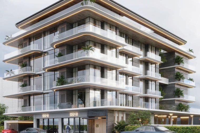Modern multi-story building with glass balconies, lush plants, and sleek design. Ground level has shop entrances and parked cars in front.