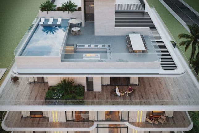 A modern rooftop terrace with a pool, sun loungers, dining area, and seating overlooking lush greenery and a stylish building.