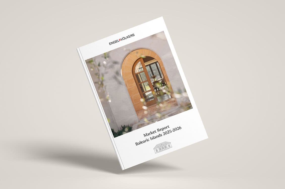 Cover of the "Market Report Balearic Islands 2025-2026" by Engel & Völkers, featuring an arched wooden door with blurred foliage.