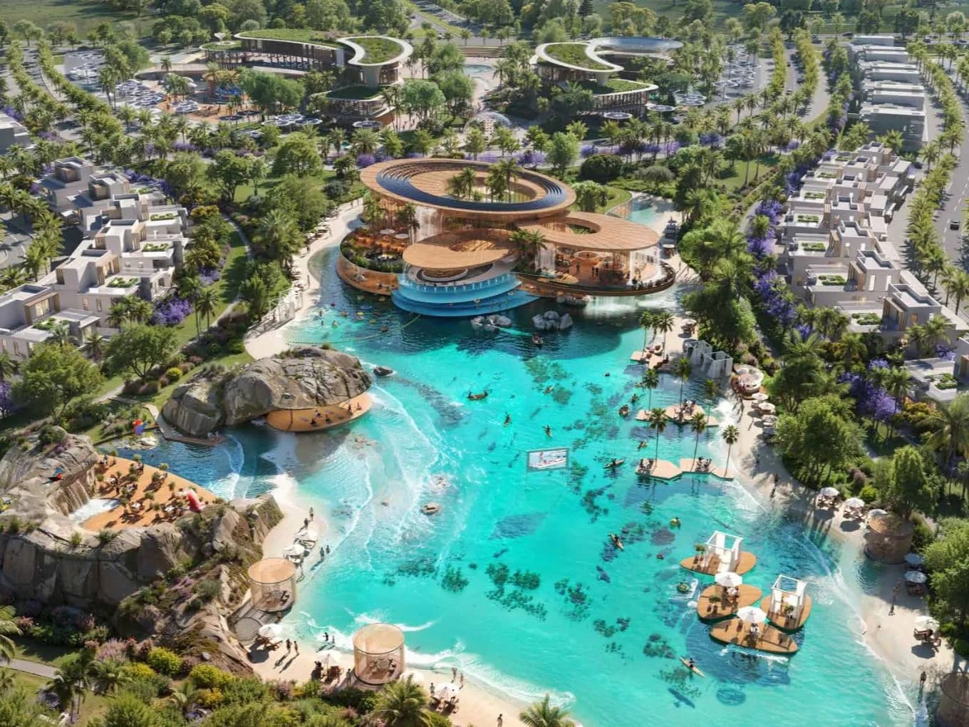 Aerial view of a luxury resort with villas, a turquoise pool, palm trees, and various recreational areas, surrounded by greenery and parking.