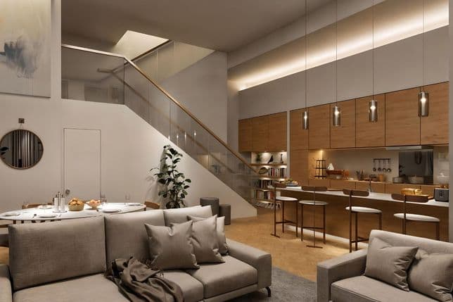 Stylish duplex apartment interior featuring an open-plan kitchen with wooden cabinetry, modern pendant lighting, staircase with glass railing, and cozy lounge area.