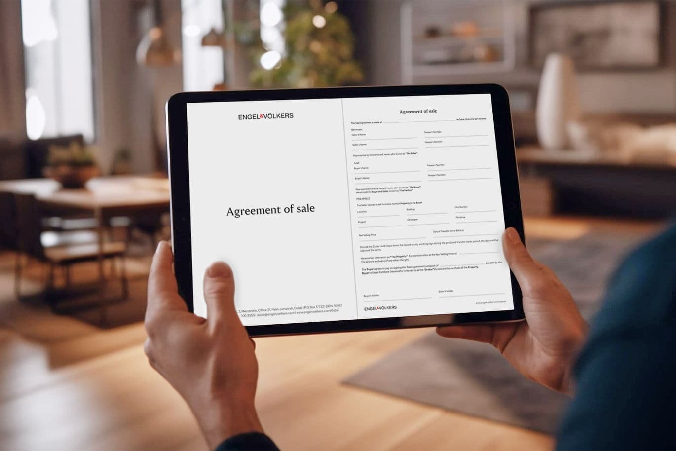Seller looks at sale and purchase agreement (SPA) on an ipad