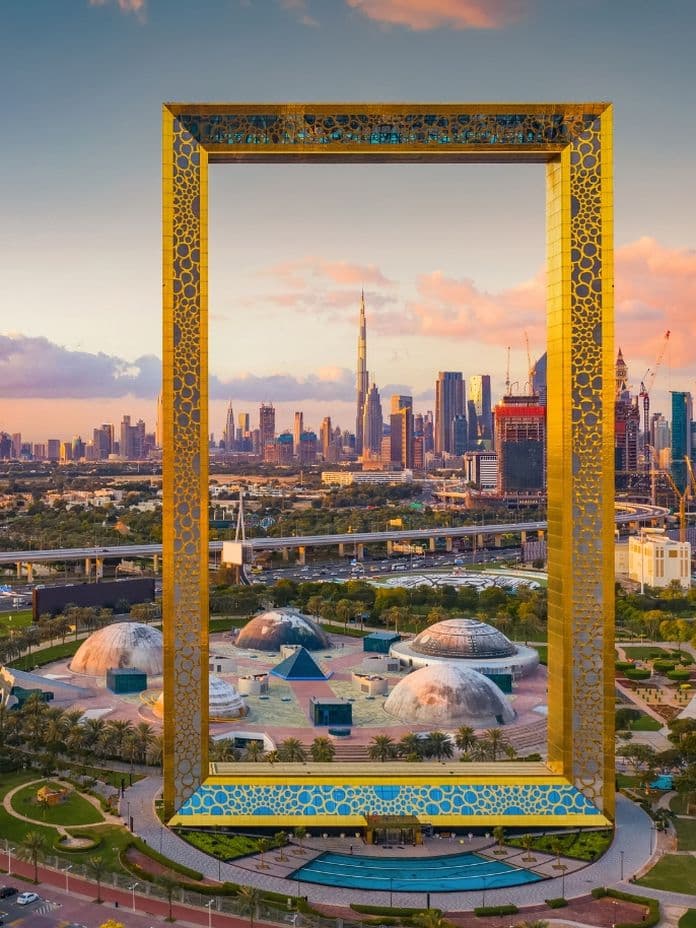 The Dubai Frame perfectly framing the Burj Khalifa in the background, a famous architectural landmark