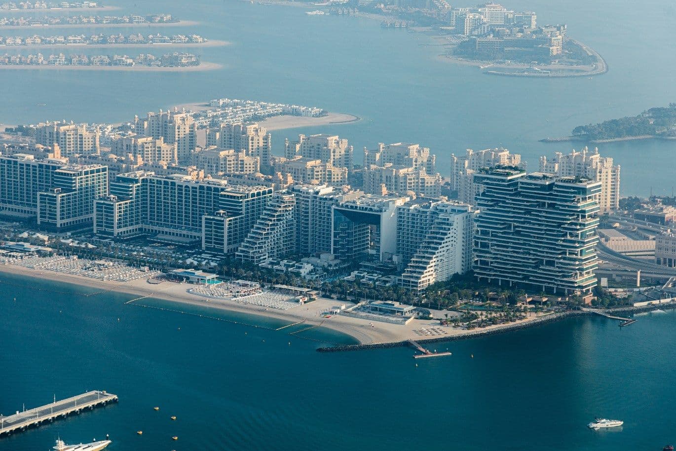 Aerial view of West Beach hotel resorts with beach clubs and restaurants