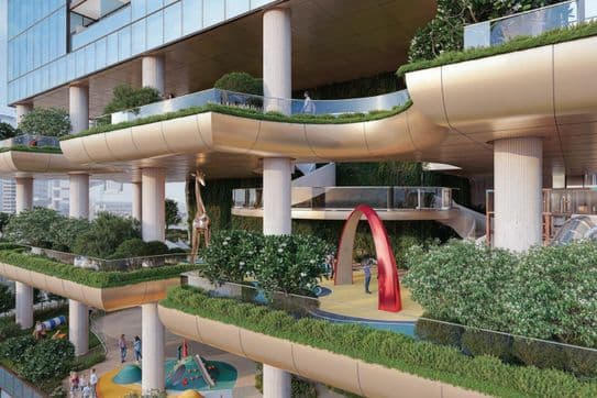 Modern building with multi-level terraces featuring greenery, a playground with a red arch, and a giraffe sculpture. People are walking around.