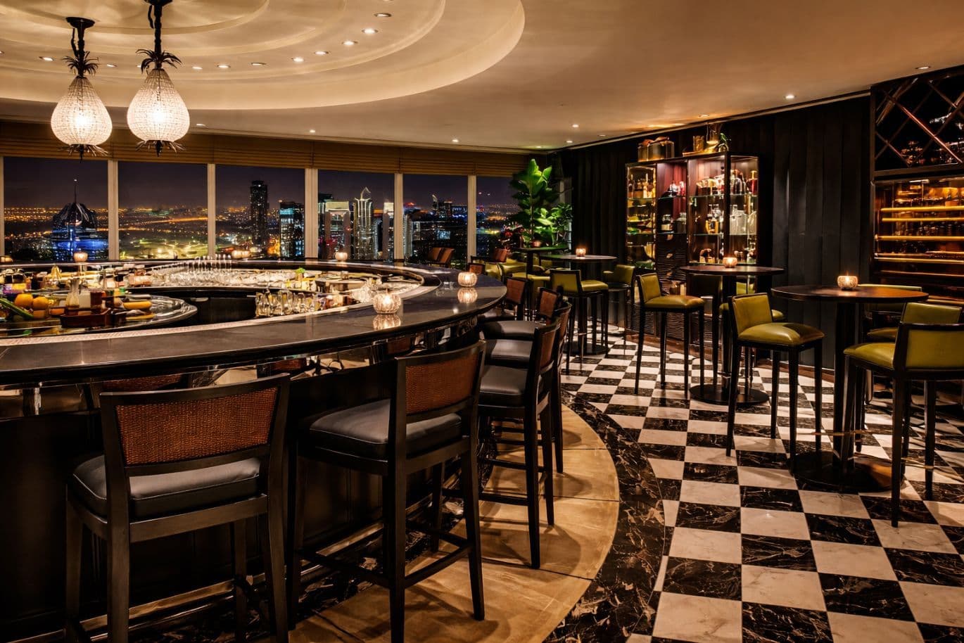 Elegant bar with checkered floor, curved counter, high chairs, candlelit tables, and large windows showcasing a city skyline at night.
