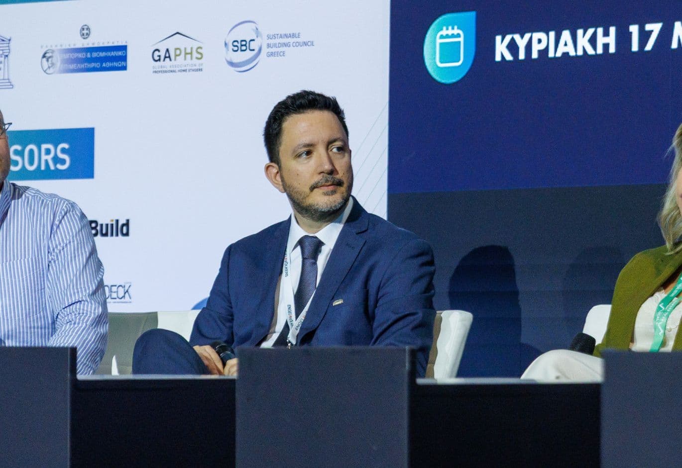 Speaker participating in a panel discussion at the Real Estate Forum conference