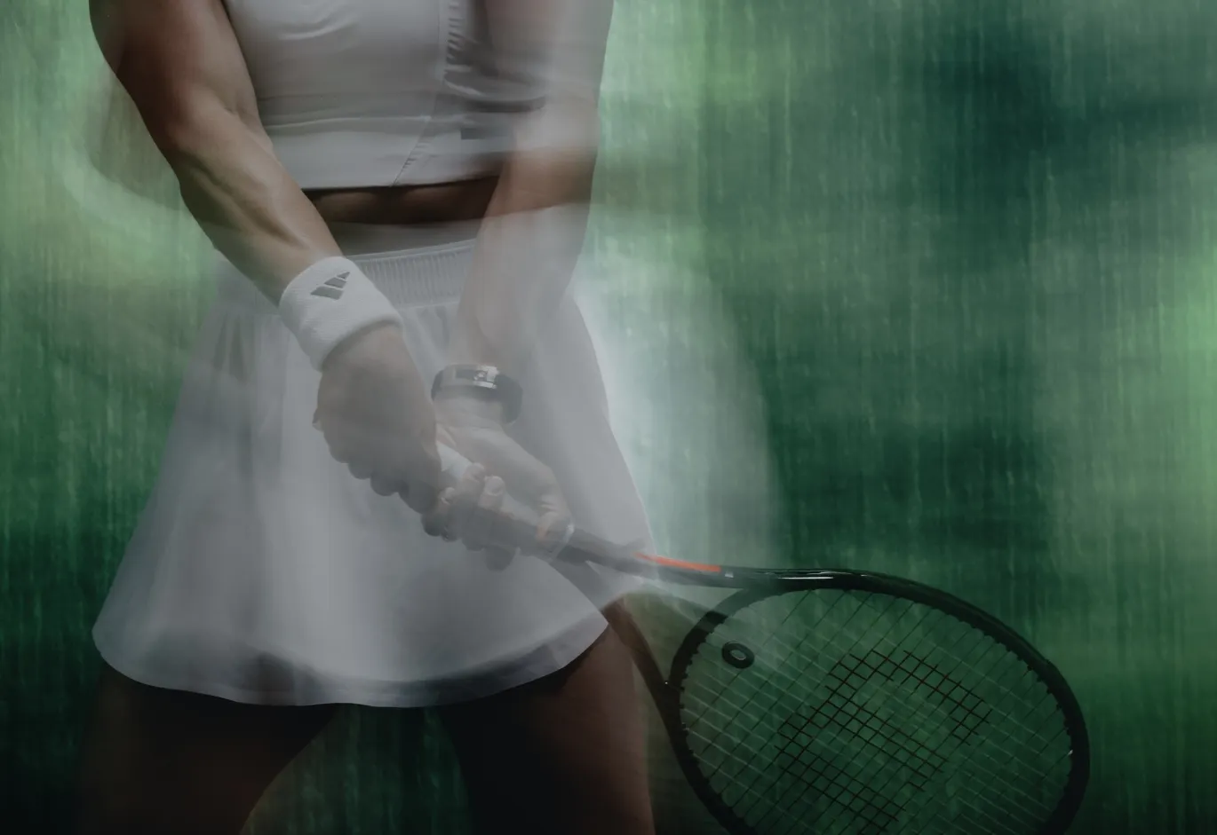 Action shot with motion blur showing tennis player Maria Sakkari preparing a two-handed backhand shot.