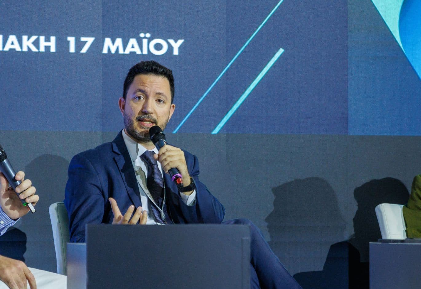 Industry expert speaking on stage during a live panel discussion at the Real Estate Forum