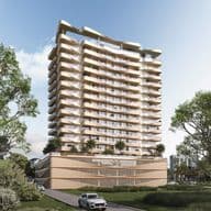 Modern high-rise building with wavy balconies, surrounded by greenery, under a clear blue sky. A car is parked on the road in front.