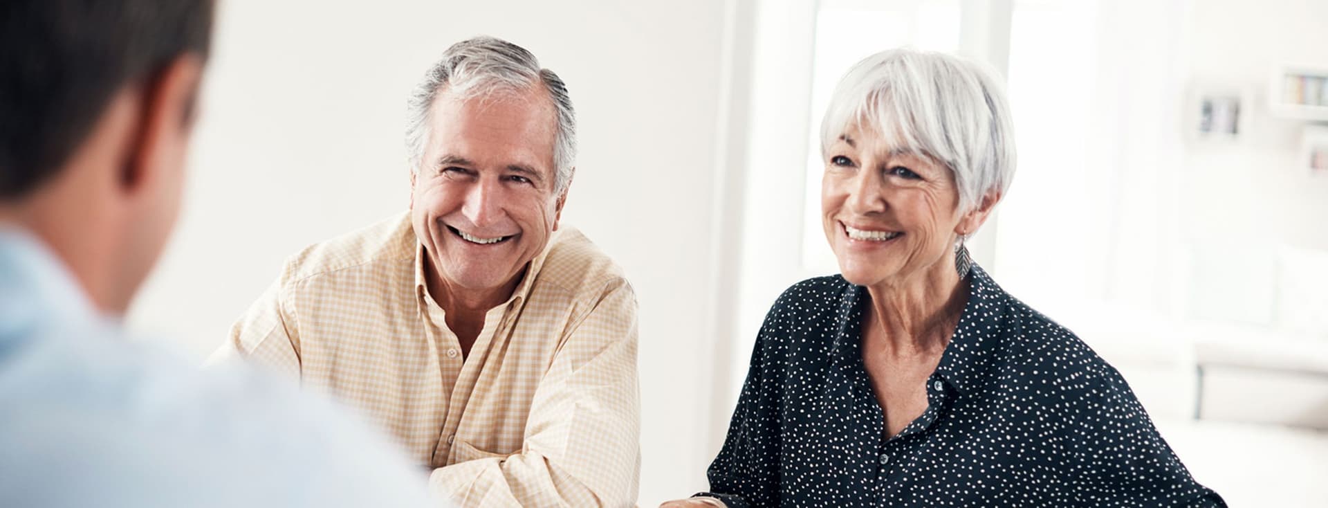 Shot of a senior couple getting advice from their financial consultant at home