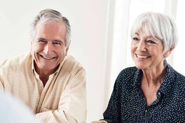 Shot of a senior couple getting advice from their financial consultant at home