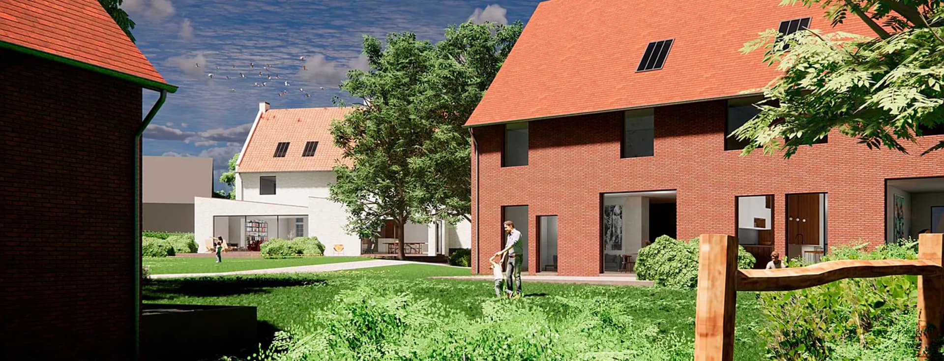 Exterior view of brick houses with red roofs, green lawn, and a man with a child in the yard.