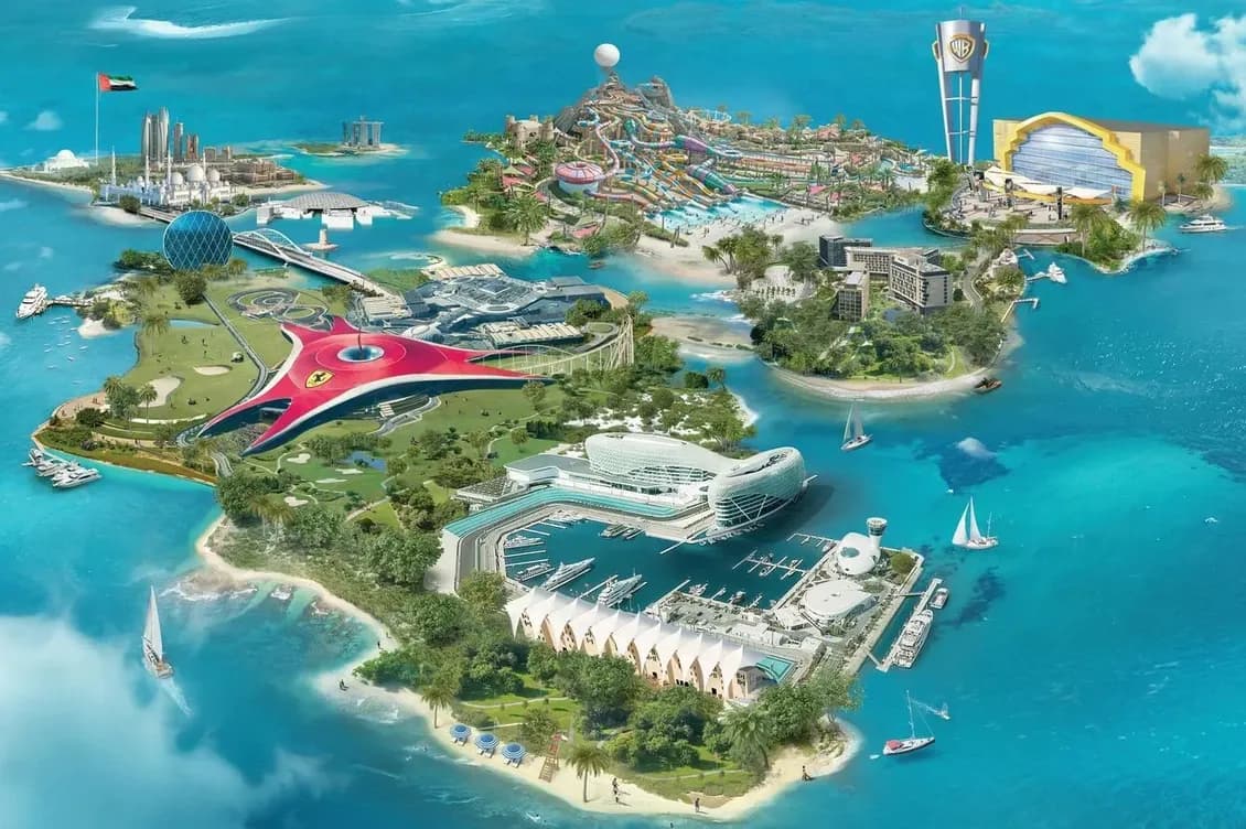 Aerial view of a vibrant island with theme parks, luxury resorts, and yachts in turquoise waters, showcasing modern architecture and attractions.
