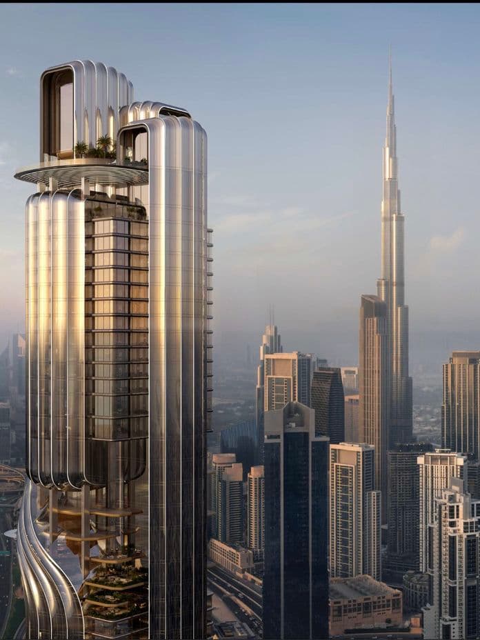 Futuristic skyscraper with a curved design and rooftop gardens, set against a city skyline with a taller iconic tower in the background at sunset.